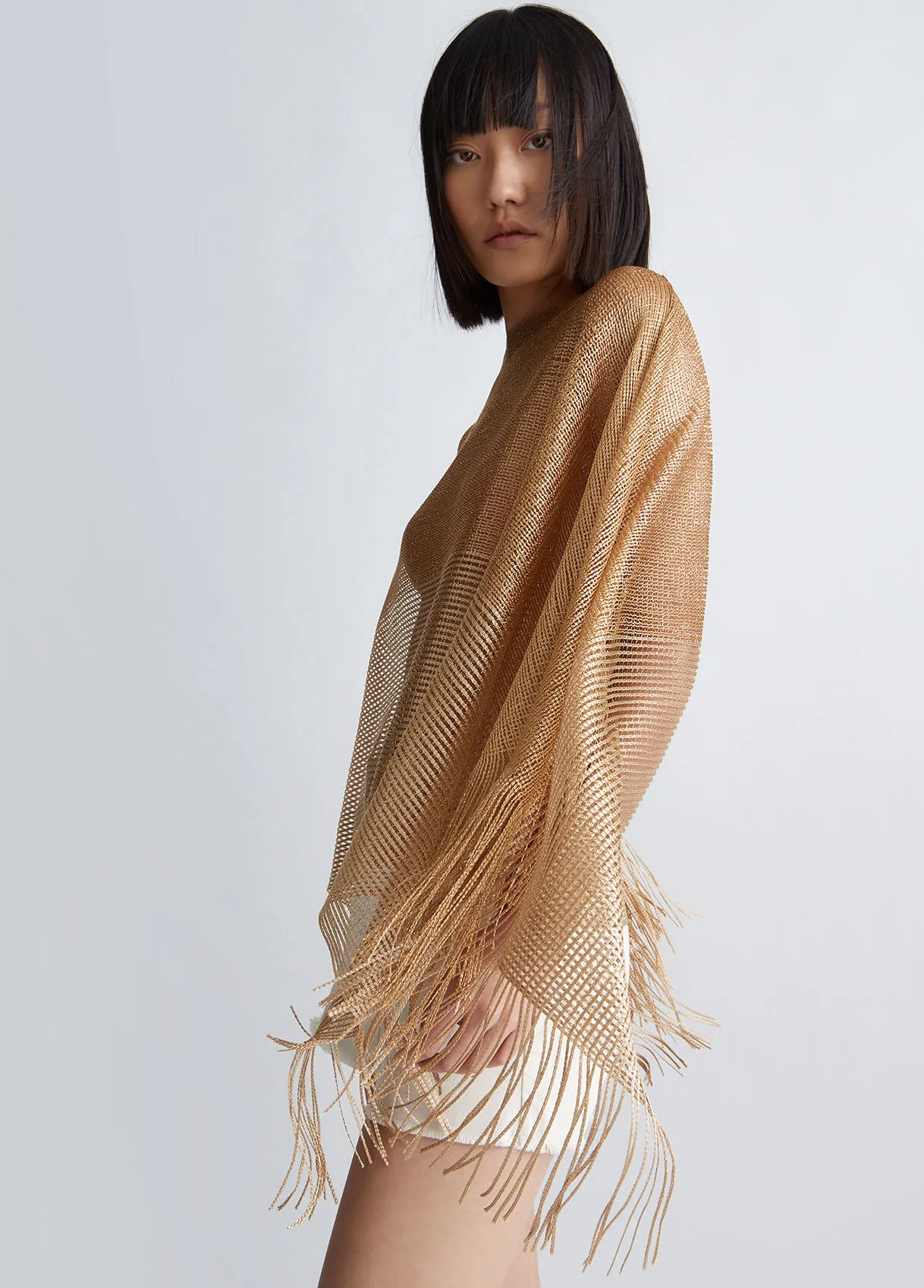 Poncho con frange